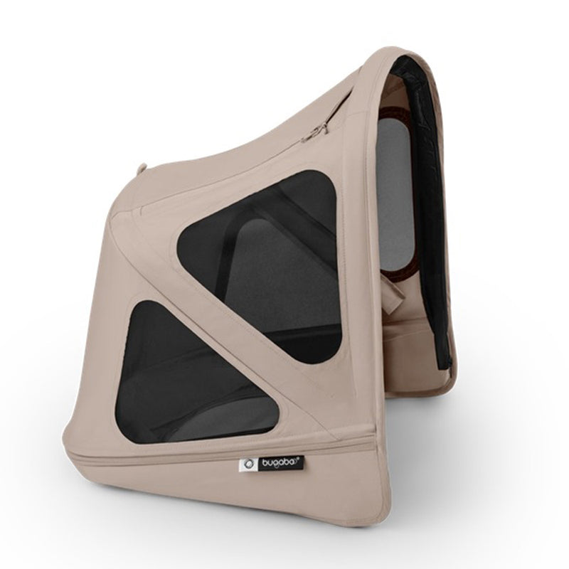 The Bugaboo Donkey 6 Breezy Sun Canopy by Bugaboo features a beige exterior, black mesh ventilation panels, and a black interior for UPF 50+ sun protection plus shade and airflow for babies.