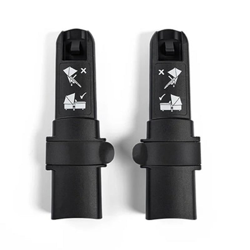 Two black Bugaboo Donkey Bassinet Height Adapters by Bugaboo stand upright side by side on a white background, with illustration stickers that show correct and incorrect ways to raise the bassinet or attach the stroller seat.