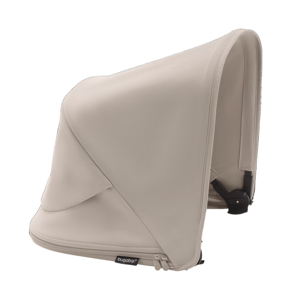 The Bugaboo Fox 5/Kangaroo Sun Canopy by Bugaboo, shown in light beige side profile, features UPF 50+ sun protection, a zippered extension for adjustable coverage, a smooth finish, and a discreet logo tag near the bottom edge.