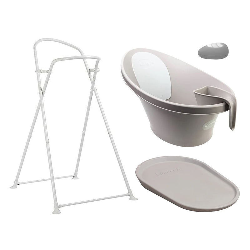 The Shnuggle Bath Bundle Taupe by Shnuggle includes a taupe foldable stand, an oval baby bath with white insert, newborn bath support pad, and gray bath plug.