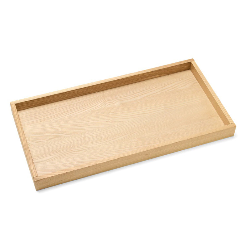 The Cariboo Mackenzie Change Tray by Cariboo is a rectangular wooden tray with raised edges and a smooth, light wood finish, ideal for use as a modern change table or dresser conversion, shown on a white background.