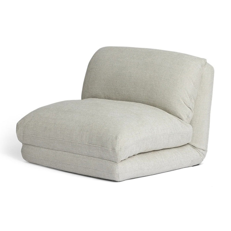The Cariboo Rylee Recliner Play Couch & Sofa Bed by Cariboo is a modern armless lounge chair with thick, light beige fabric cushions—a stylish toddler recliner—shown against a white background.