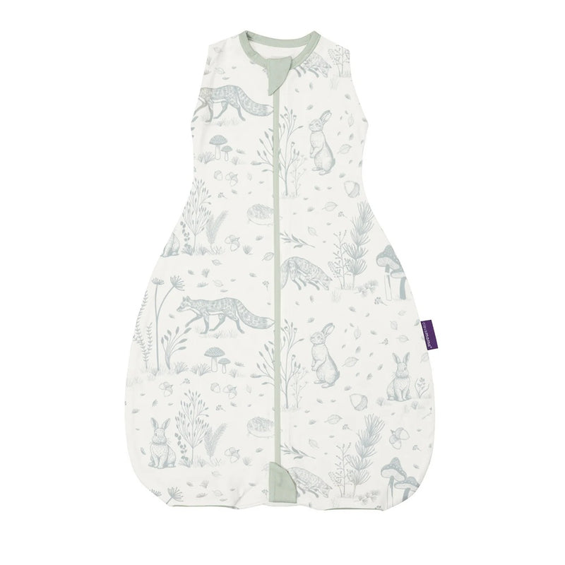 The Clevamama ClevaSleep DreamSuit 1.0 Tog Forest Friends is a white, sleeveless baby sleep sack with light grey animal and nature prints, featuring foxes and rabbits, a front zipper, and light green trim around the neck and zipper ends.