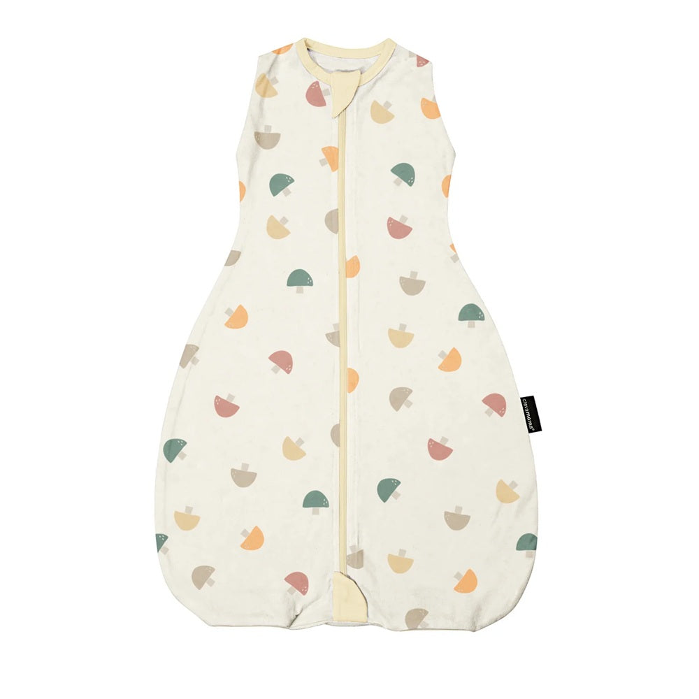 The Clevamama ClevaSleep DreamSuit 2.5 Tog Mushroom is a cream-colored, sleeveless baby sleep sack made from soft Australian cotton, featuring a front zipper and decorated with multicolored acorn patterns.
