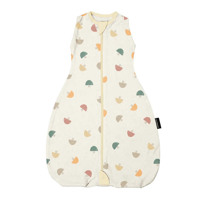 The Clevamama ClevaSleep DreamSuit 2.5 Tog Mushroom is a cream-colored, sleeveless baby sleep sack made from soft Australian cotton, featuring a front zipper and decorated with multicolored acorn patterns.