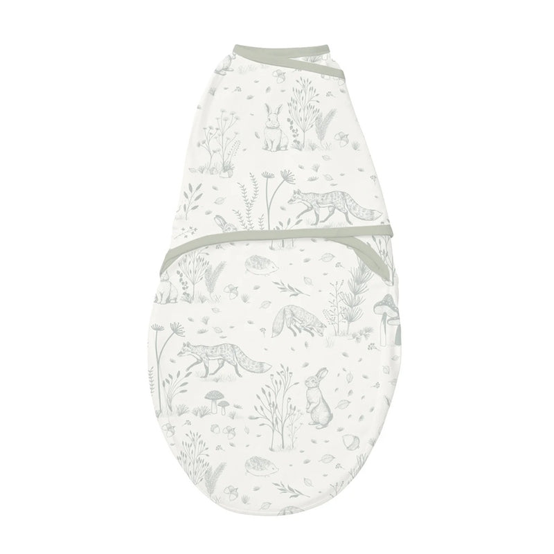 The Clevamama ClevaSleep Swaddle Forest Friends is a soft, white Australian cotton swaddle with light grey woodland animals and trees. This breathable, cozy wrap has top and side flaps for snugly swaddling newborns.