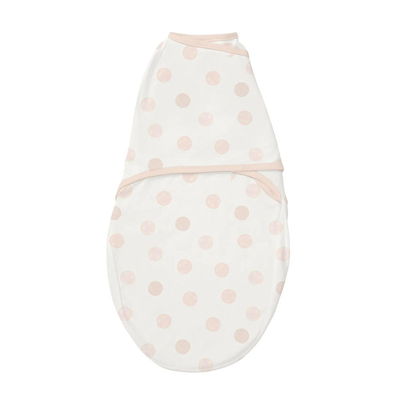The Clevamama ClevaSleep Swaddle Pink Spot by Clevamama is a breathable white baby swaddle with soft pink polka dots and light pink trim—ideal for keeping your newborn snug and cozy.
