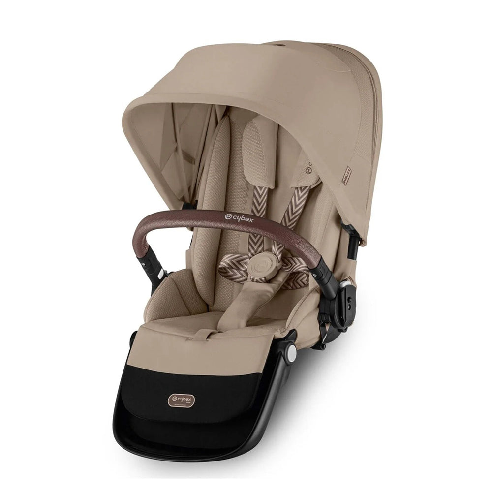 The Cybex Gazelle S Second Seat by Cybex is shown from the front, featuring a beige padded ergonomic lie-flat seat, UPF50+ sun canopy, harness, and a brown safety bar against a white background.