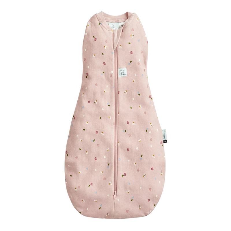 The ErgoPouch 0.2 Tog Cocoon Daisies by ErgoPouch is a pink, floral-patterned swaddle with a front zipper, shown laid flat on a white background—ideal for cozy newborn sleep.