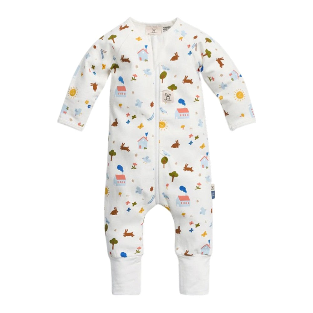 The ErgoPouch 1.0 Tog Layers by ErgoPouch is a white, organic long sleeve baby bodysuit with a front zipper and colorful prints of houses, trees, animals, suns, and clouds—perfect for cozy comfort and playful style.