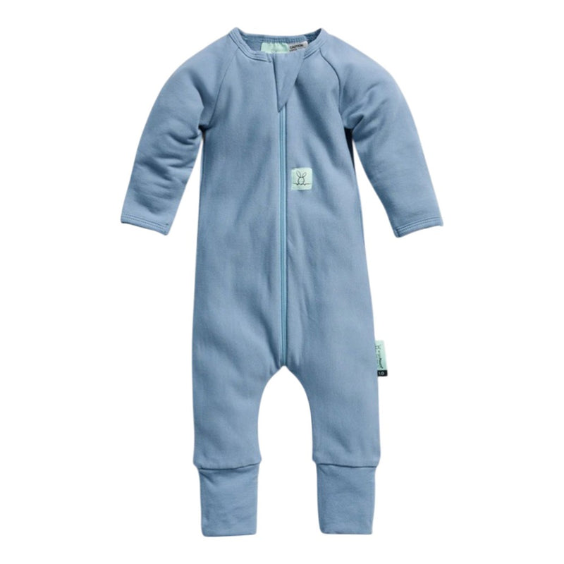 The ErgoPouch 2.0 Tog Layers by ErgoPouch is a light blue, long-sleeved newborn bodysuit made from organic jersey cotton, featuring a front zipper, small chest tag, closed feet, and ribbed cuffs—perfect for cozy layering and comfort.