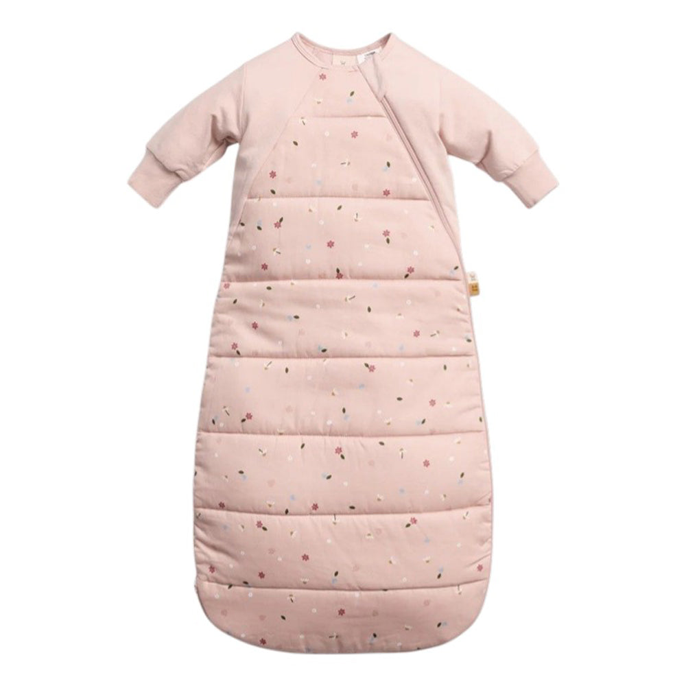 The ErgoPouch 2.5 Tog Side Zip Sheeting Bag Daisies by ErgoPouch is a pale pink, hip-friendly baby sleeping bag with long sleeves, a side zipper, small daisy floral print, and a quilted lower section for extra warmth.