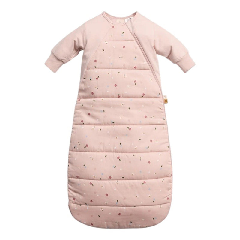 The ErgoPouch 2.5 Tog Side Zip Sheeting Bag Daisies by ErgoPouch is a pale pink, hip-friendly baby sleeping bag with long sleeves, a side zipper, small daisy floral print, and a quilted lower section for extra warmth.