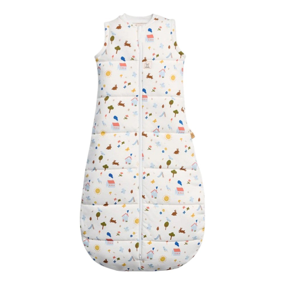 The ErgoPouch 2.5 Tog Sleeping Bag by ErgoPouch is a sleeveless, white organic cotton sleeping bag with a front zipper and colorful prints, offering quilted padding for comfort and warmth for your baby.