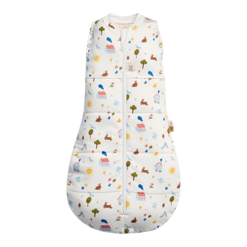 The ErgoPouch 3.5 Tog Cocoon by ErgoPouch is a sleeveless swaddle baby sleeping bag with a front zipper, featuring colorful animals, trees, suns, and clouds on a white background.