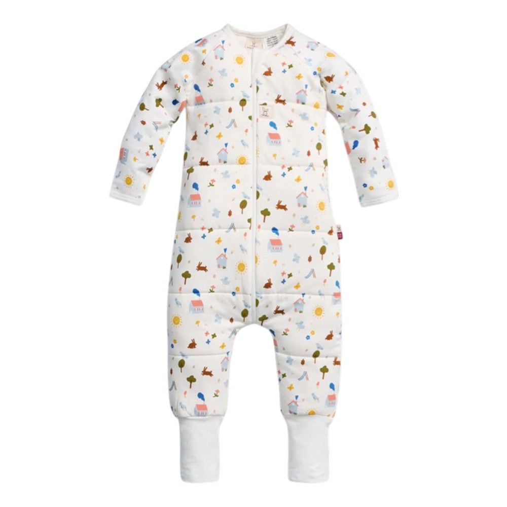 The ErgoPouch 3.5 Tog Sleep Onesie by ErgoPouch is a TOG-rated sleeping bag alternative with sleeves and legs, a front zipper, white cuffs, and a colorful animal, tree, and sun print on white organic cotton.