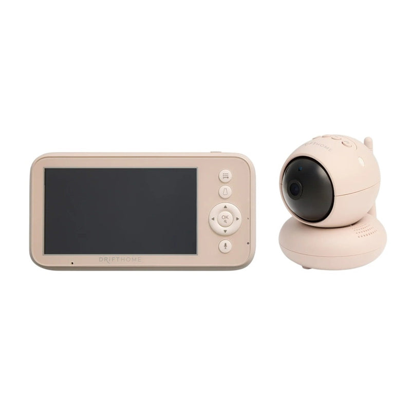 The ErgoPouch Drift Home Baby Monitor + Smart Tog Guide by ErgoPouch features a beige rectangular handheld screen and a round camera unit, both with simple buttons and modern design—helping parents ensure safe sleep for their baby.