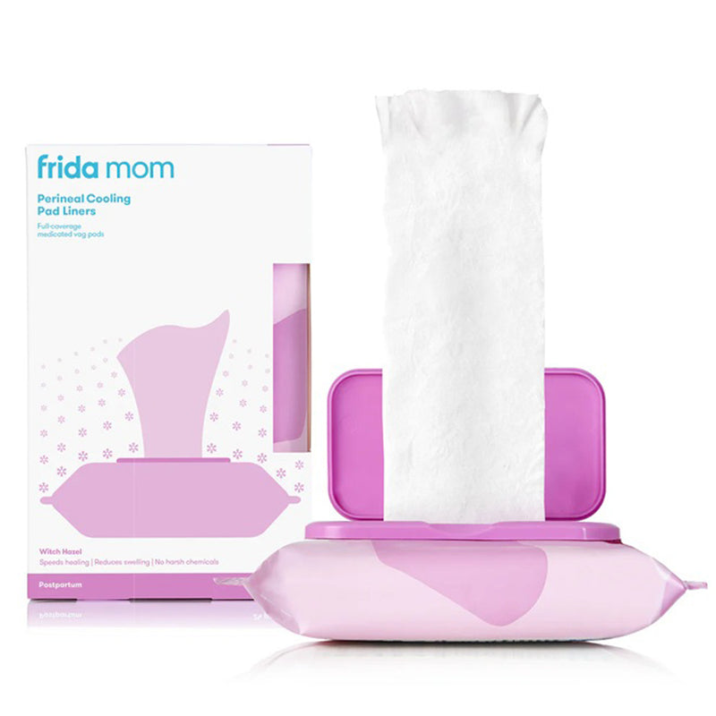 A package and an open container of Frida Mom Perineal Cooling Pad Liners are shown; one white witch hazel pad liner is partially pulled out of the purple Frida Mom container.