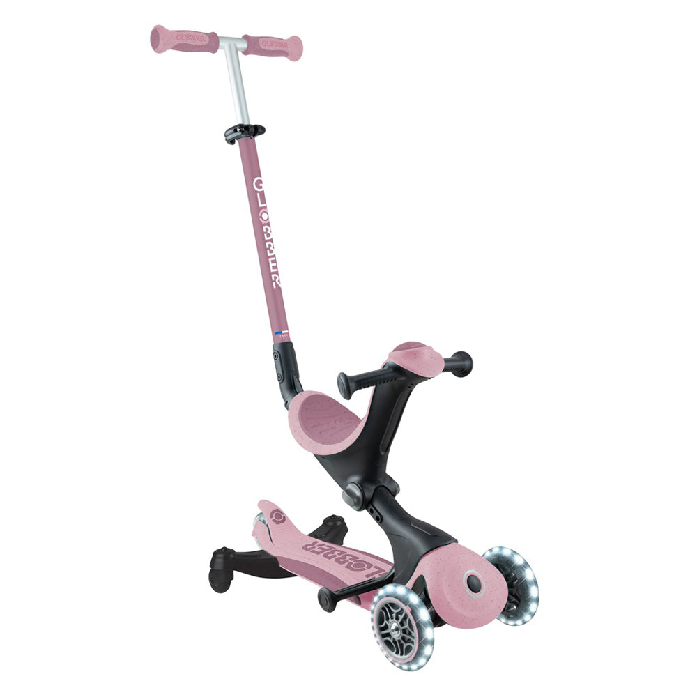 The Globber Go Up Deluxe Ecologic 360 is a pink and black 3-wheel kids scooter with adjustable handlebar, built-in seat, light-up transparent wheels, and visible Globber branding—designed for fun and style for young riders.