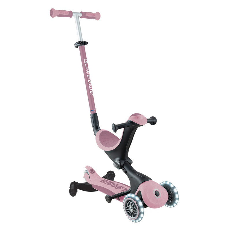 The Globber Go Up Deluxe Ecologic 360 is a pink and black 3-wheel kids scooter with adjustable handlebar, built-in seat, light-up transparent wheels, and visible Globber branding—designed for fun and style for young riders.