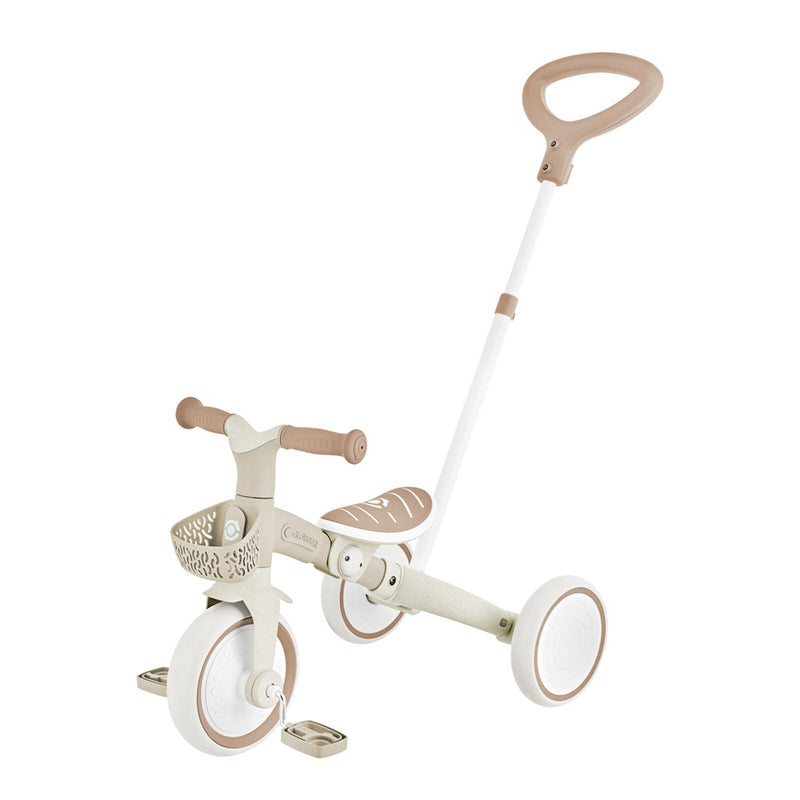 The Globber Learning Trike 3in1 PLUS by Globber is a beige and white toddler tricycle with a front basket, two rear wheels, pedals, and a tall rear handlebar for adult steering—ideal as a first learning trike.
