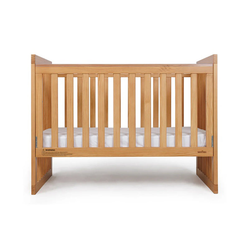 The Grotime Grace Cot by Grotime is a wooden baby cot featuring vertical slats and a white mattress, displayed against a white background.
