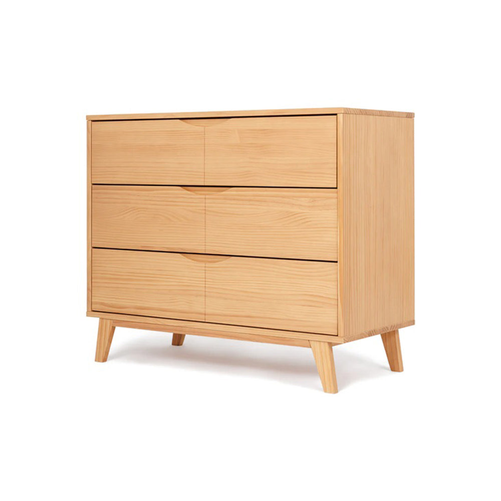 The Grotime Mia / Corby Chest by Grotime is a modern nursery dresser crafted from sustainable New Zealand Pine, featuring three wide drawers, angled legs, and a minimalist design.