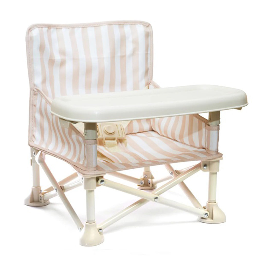 The IZIMINI Billie Baby Chair V2 is a beige and white striped portable toddler seat with a removable tray and collapsible frame, perfect for easy transport and on-the-go feeding.