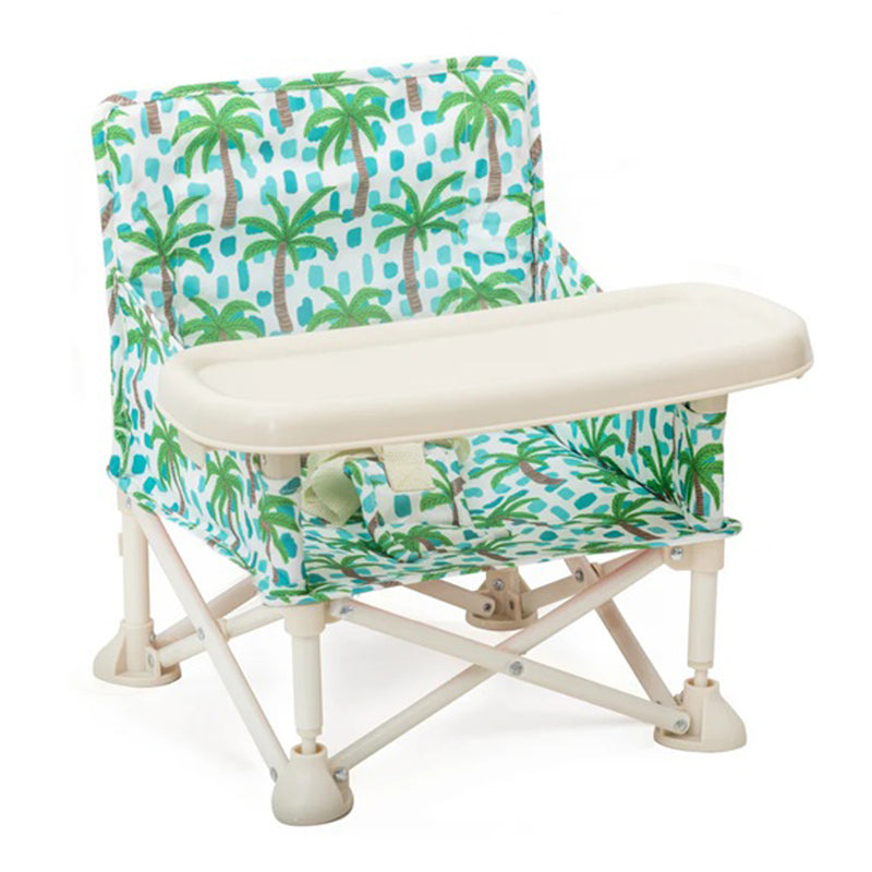 The IZIMINI Kai Baby Chair V2 is a foldable, portable booster seat with a tropical palm tree print and beige tray. It features a secure harness, ideal for on-the-go families in Australia seeking comfort and style for their baby.