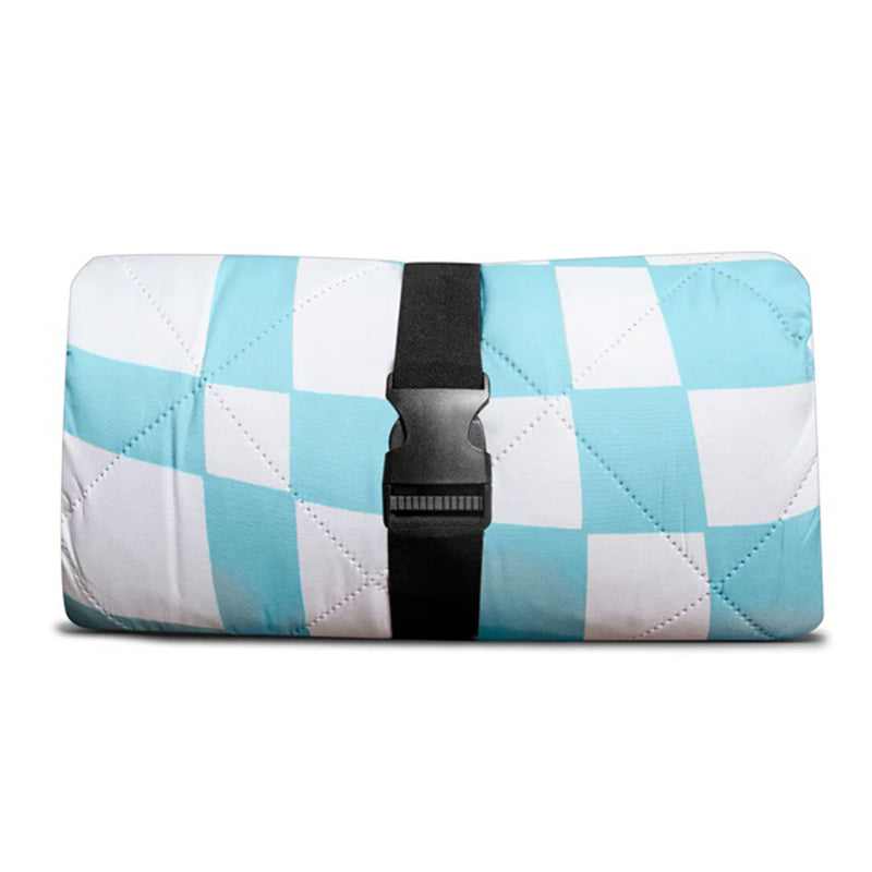 The IZIMINI Harper Picnic Rug by IZIMINI is a folded blue and white checkered, sand-proof, and water-resistant mat secured with a black strap and buckle, shown against a plain white background.