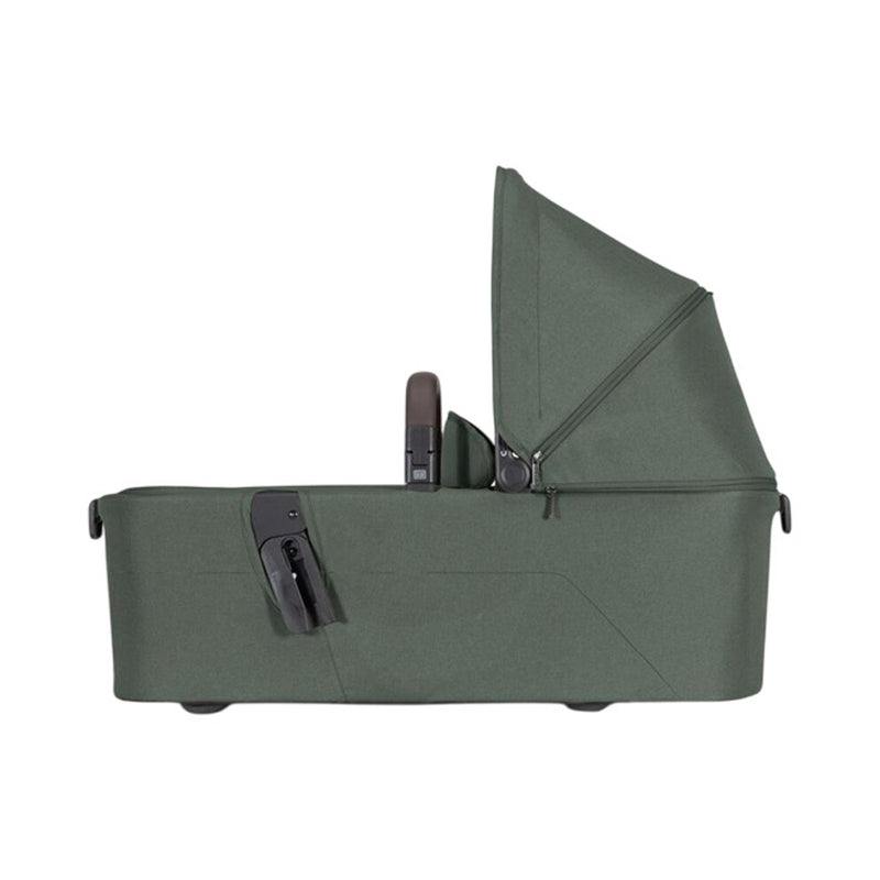 The Joolz Aer2 Bassinet by Joolz is shown in green with a canopy and black attachment, viewed from the side on a white background. This lightweight bassinet is compatible with Joolz Aer2 stroller models.