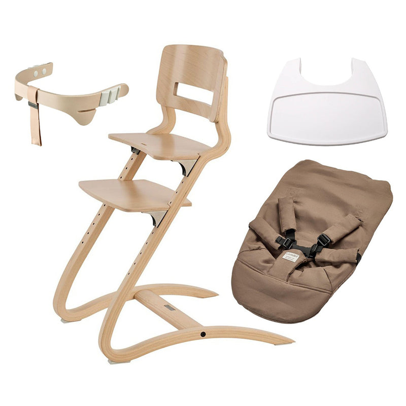 The Leander Louie Chair Newborn Bundle by Leander is a wooden adjustable highchair with a curved Scandinavian design, shown with a beige safety harness, white tray, and brown padded seat cover with straps.