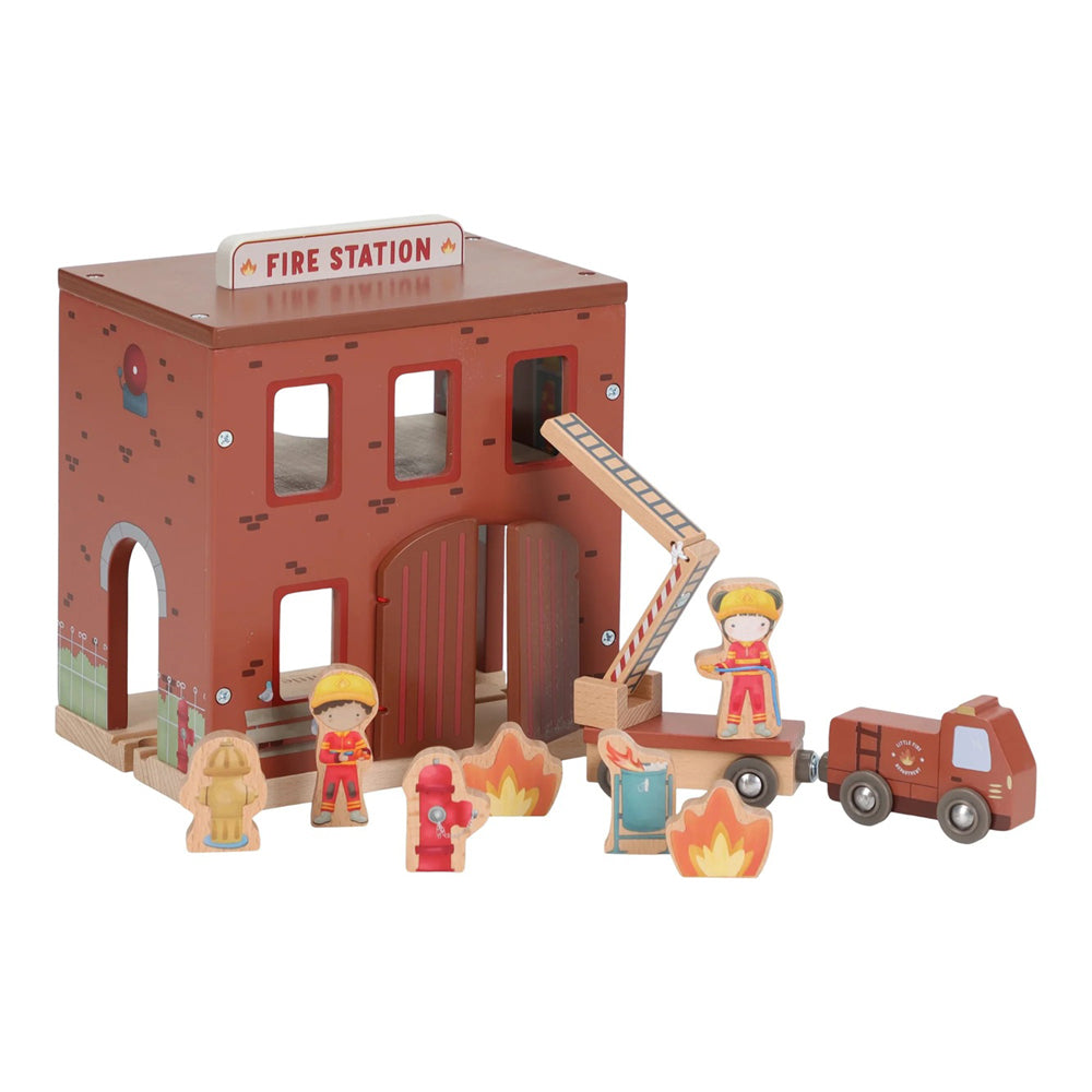 The Little Dutch Firestation by Little Dutch includes a vibrant wooden firehouse, fire truck, hydrant, ladder, flames, and firefighter figures arranged in front of the station.