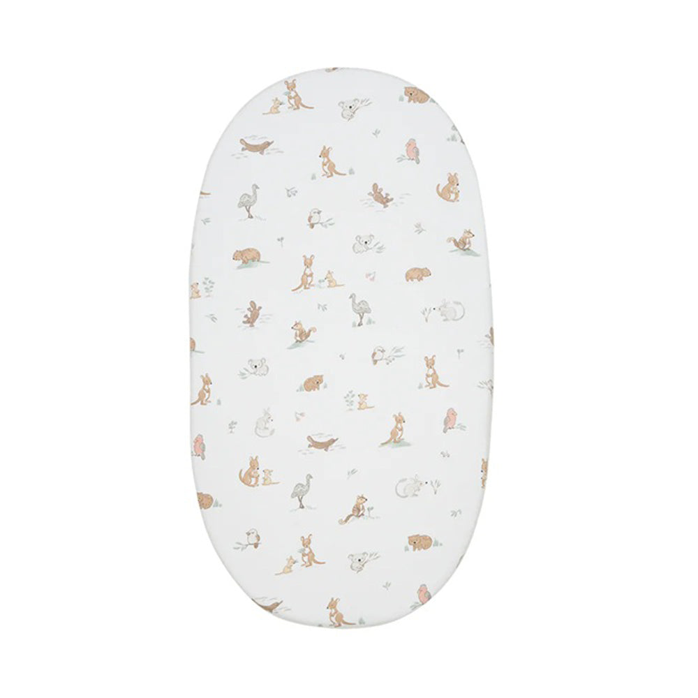 The Living Textiles Bassinet Fitted Sheet Australiana by Living Textiles is an oval organic cotton sheet with a white background and pastel animal print—perfectly adorable for your baby’s nursery bedding.