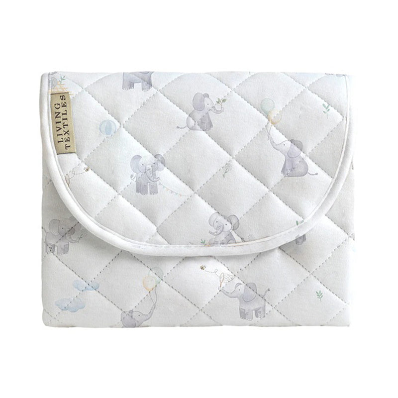 The Living Textiles Foldable Travel Change Mat Elephant Playtime features organic cotton with quilted white fabric, decorated with gray elephants holding balloons. It includes a flap and a "LIVING TEXTILES" side tag for style and convenience.