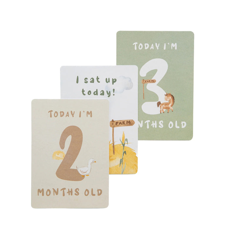 The Living Textiles Milestone Cards Tractor Ride set by Living Textiles features three illustrated baby milestone cards—ideal nursery essentials and a perfect baby shower gift, with cute “Today I’m 2 months old,” “I sat up today!” and “Today I’m 3 months old” designs.