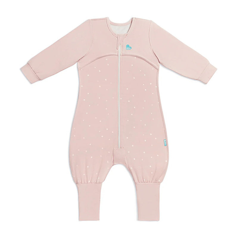 The Love To Dream Sleep Suit 1.0T Stretch Cotton Twinkle Powder Pink features long sleeves and legs, white polka dots, ribbed cuffs, a front zipper, and a blue heart logo—perfect for keeping your baby cozy at night.