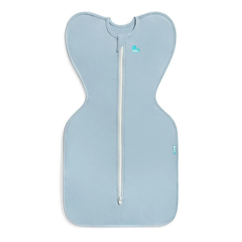 The Love To Dream Swaddle Up 0.2T Stretch Cotton Soft Blue baby swaddle features a winged design for an arms up position, promoting self-soothing, with a white center zipper and is shown on a plain white background.