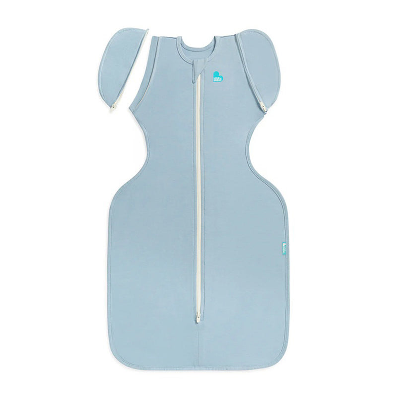 The Love To Dream Swaddle Up Transition Bag 0.2T in Soft Blue, a sleeveless stretch cotton design with zip-off wings, hip-healthy fit, and front zipper by Love To Dream, is shown laid flat on a white background.