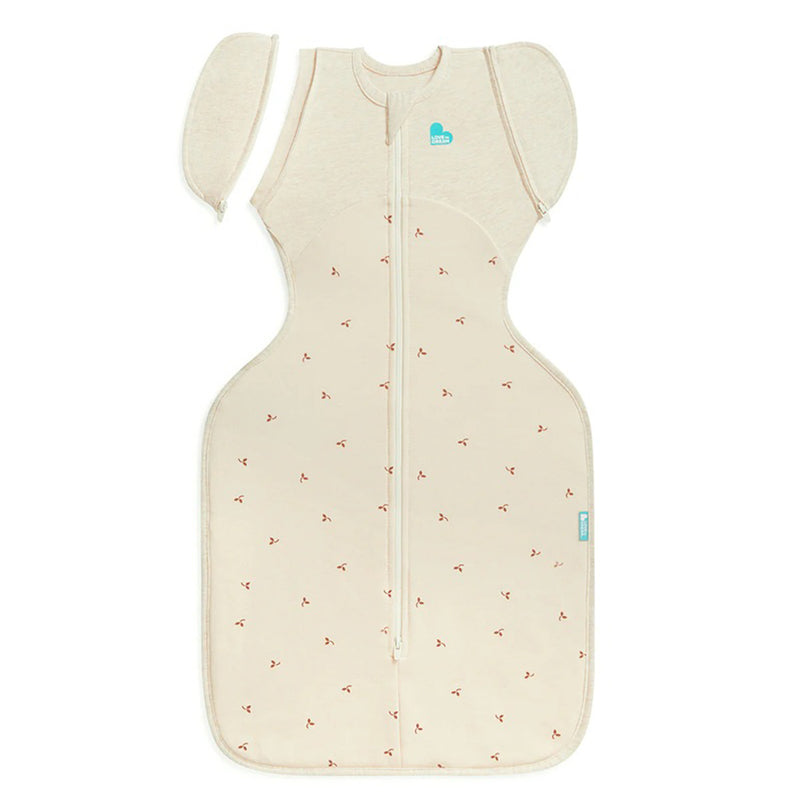 The Love To Dream Swaddle Up Transition Bag 1.5T in Twigs Oatmeal by Love To Dream features removable wing-shaped sleeves, a front zipper, and soft stretch cotton fleece for safe, comfortable infant sleep as your baby transitions from swaddling.