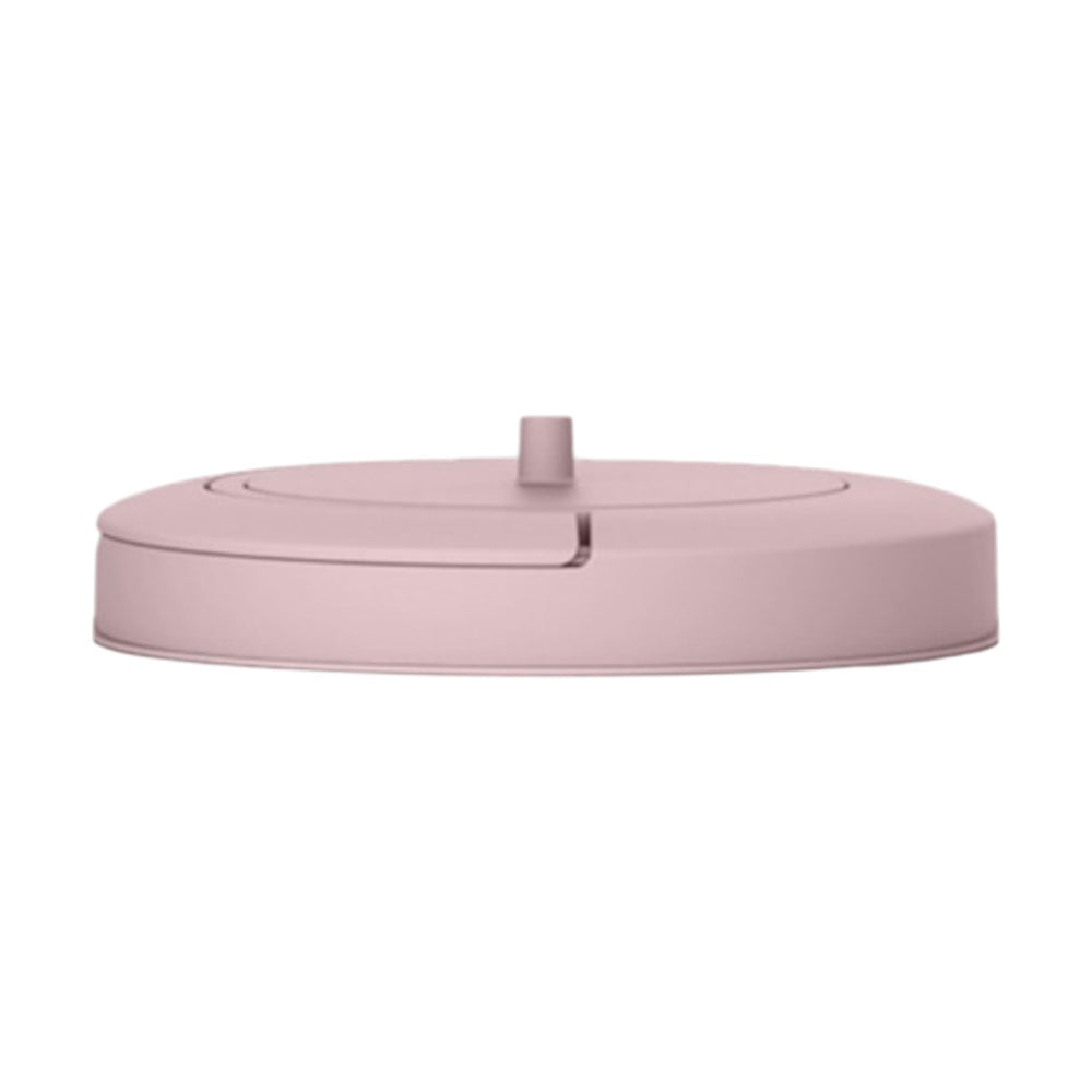 The Magic Magestic/Thoth Bin Lid by Magic is a round, flat, light pink lid with a central knob and curved groove—perfect as a stylish nappy bin or bathroom bin accessory.