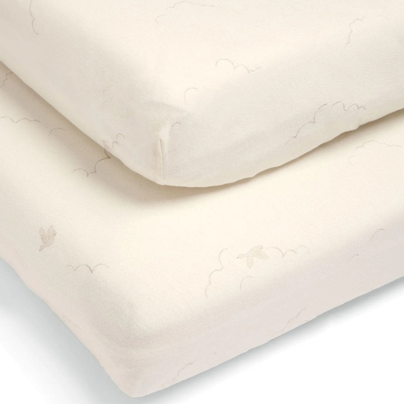The Mamas & Papas Cotbed Fitted Sheets 2pk Duckling Cream by Mamas & Papas includes two ultra-soft cream-colored cotton sheets with a delicate pattern of outlined clouds and small birds—ideal for baby bedding.