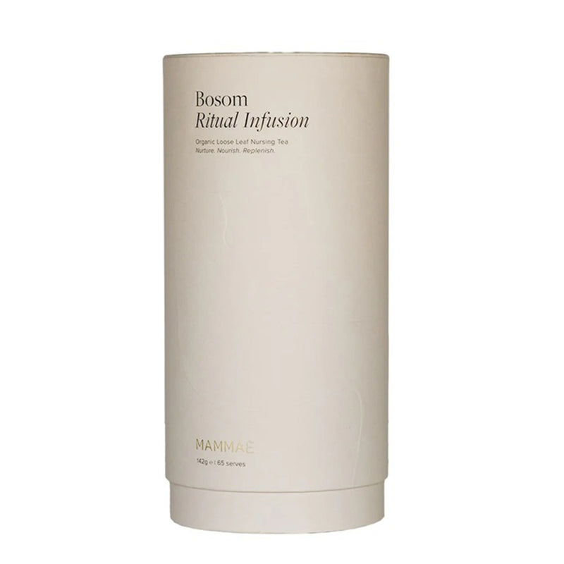 A cylindrical beige container labeled "Mammae Bosom Ritual Infusion Loose Leaf Nursing Tea" by Mammae features a minimalist design, subtle gold text, and offers breastfeeding support as an organic herbal infusion.