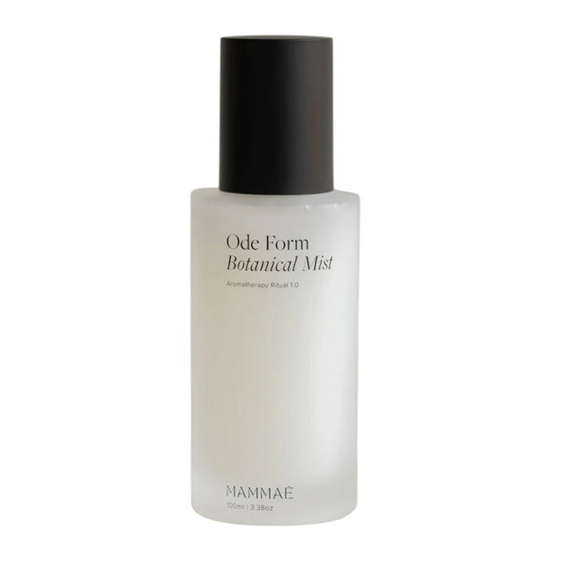 The Mammae Ode Form Botanical Mist 100ml is a frosted glass spray bottle with a black cap, ideal as a botanical body mist for breastfeeding rituals. The label displays "Mammae" and the 100 ml (3.38 oz) volume.