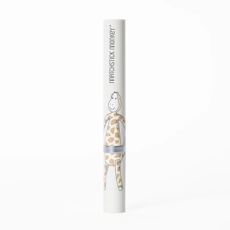 A white tube labeled "Matchstick Monkey" and featuring a giraffe illustration stands upright on a plain background, highlighting the Matchstick Monkey Baby Sonic Toothbrush’s ultra-soft bristles and Biocote antimicrobial protection.