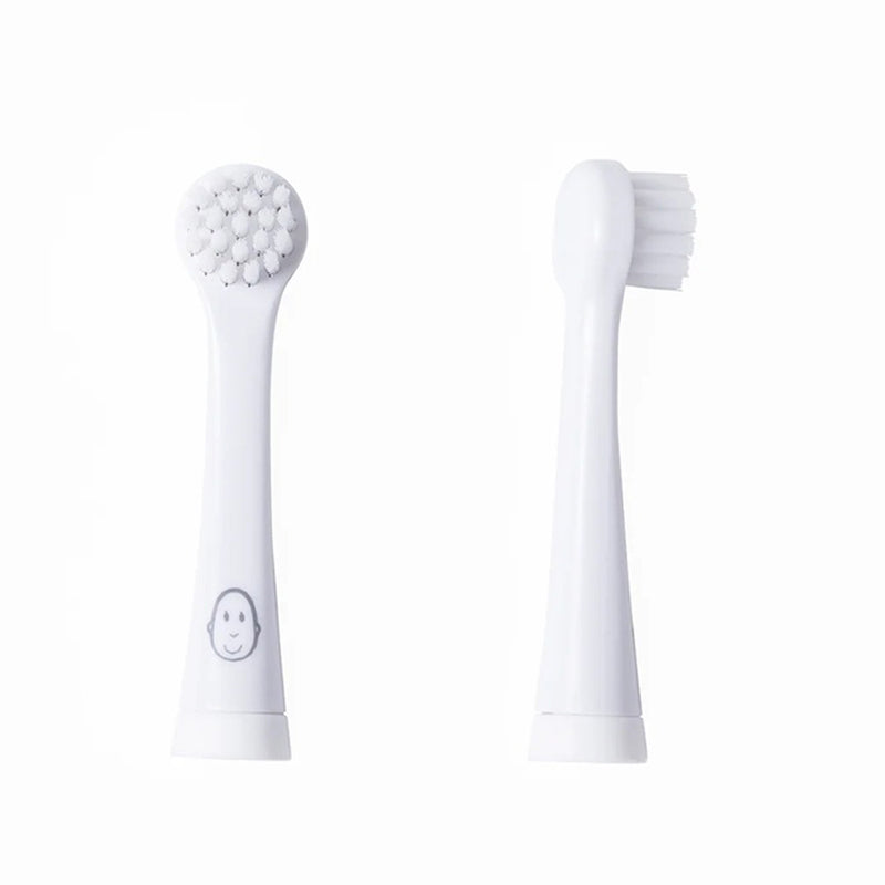 Two Matchstick Monkey Baby Sonic Toothbrush Replacement Heads by Matchstick Monkey are shown—one displaying bristles with a smiley face base, the other in profile. Perfect for gentle baby oral care.