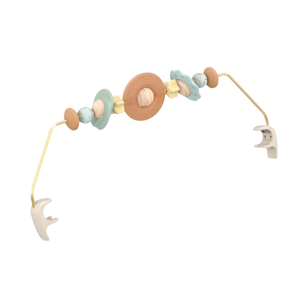 The Maxi Cosi Dove Toy Arch is a beige and pastel sensory arch with clip-on ends and wooden planet and star beads, ideal for stroller or car seat play and baby development—compatible with Maxi Cosi products.