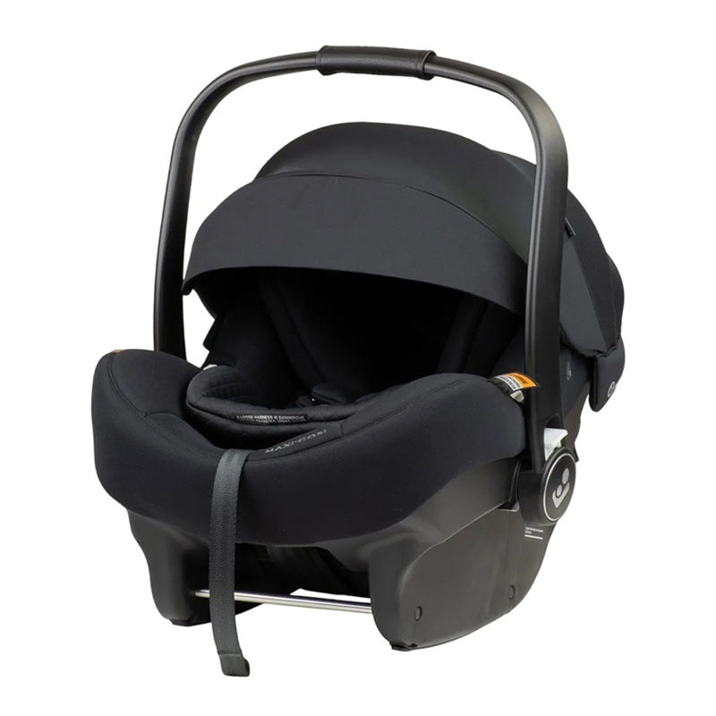 The Maxi Cosi Mico 12 LX Pro ISOFIX is a black baby capsule with a curved handle, sun canopy, padded interior, rear-facing design, and ISOFIX compatibility for secure car installation.