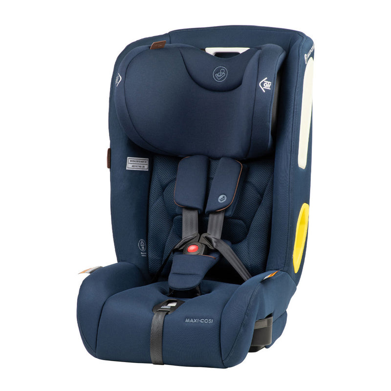 A navy blue Maxi Cosi Tuva LX forward-facing car seat with padded sides, adjustable headrest, five-point harness, yellow and white accents, and "Maxi Cosi" branding on the front.