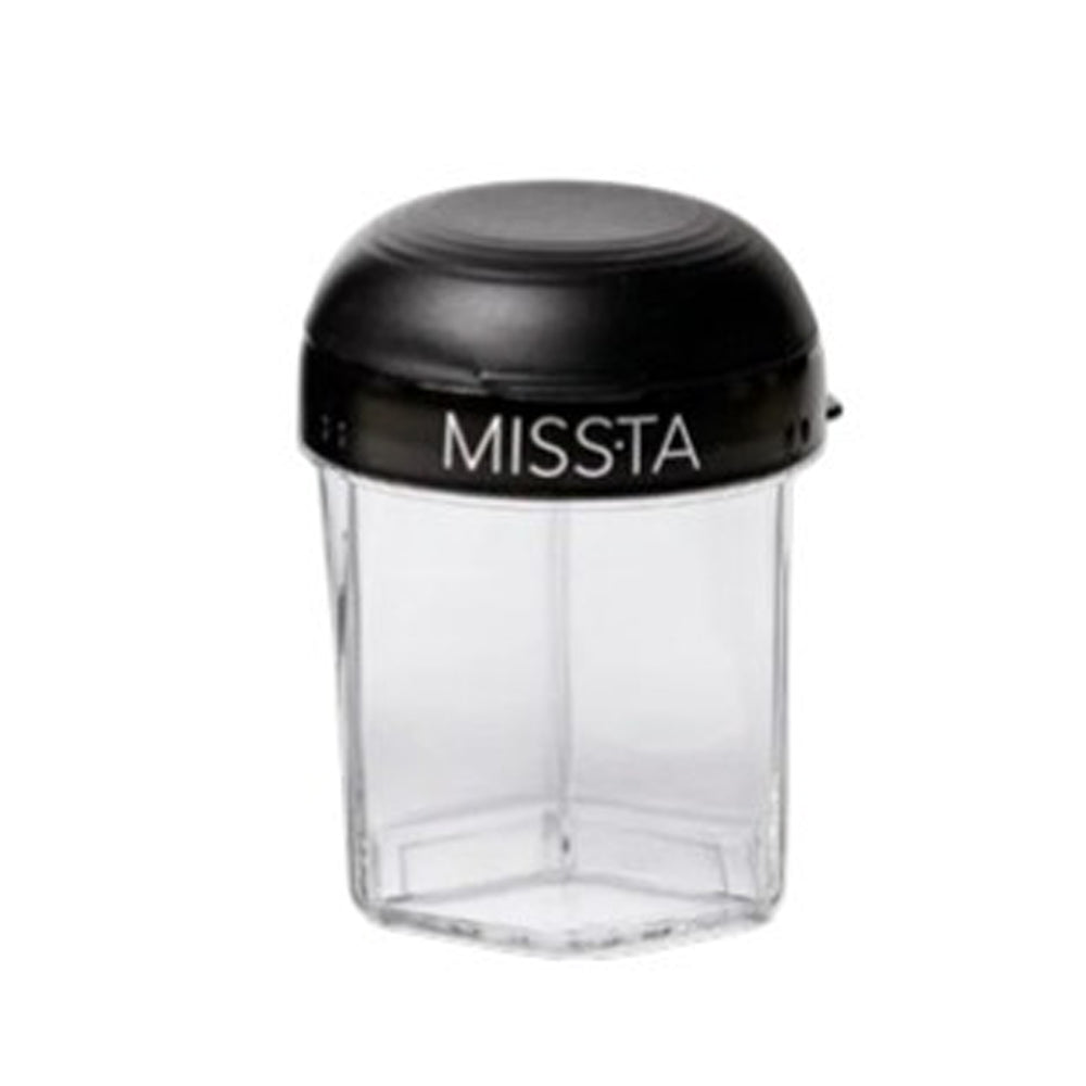The Missta Formula Dispenser by Missta features a clear, hexagonal design with a black lid. This modern, spill-proof container is ideal for baby feeding and is shown empty against a white background.